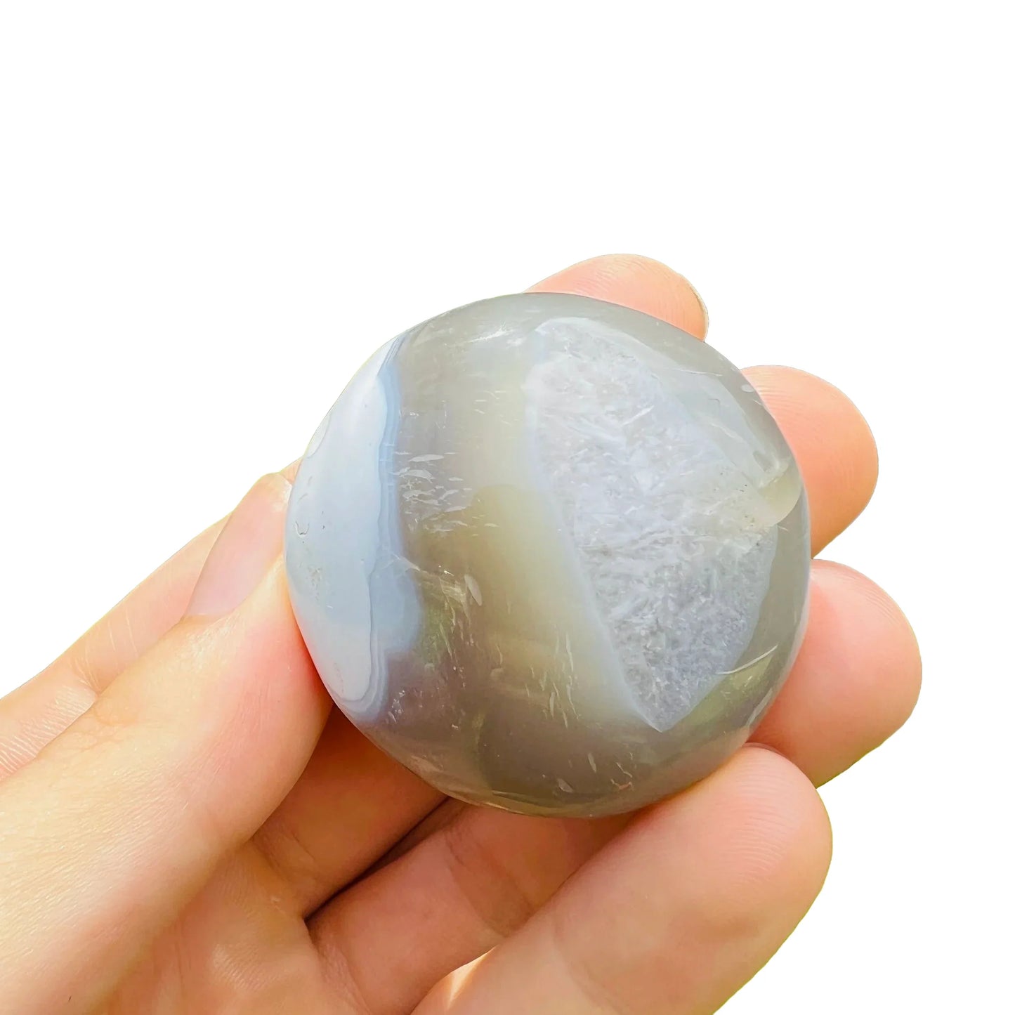 In context of an Orca Agate palm stone, from Sofia, Madagascar, shown for size reference.