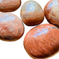 Close-up of Peach Moonstone palm stone, from Madagascar.