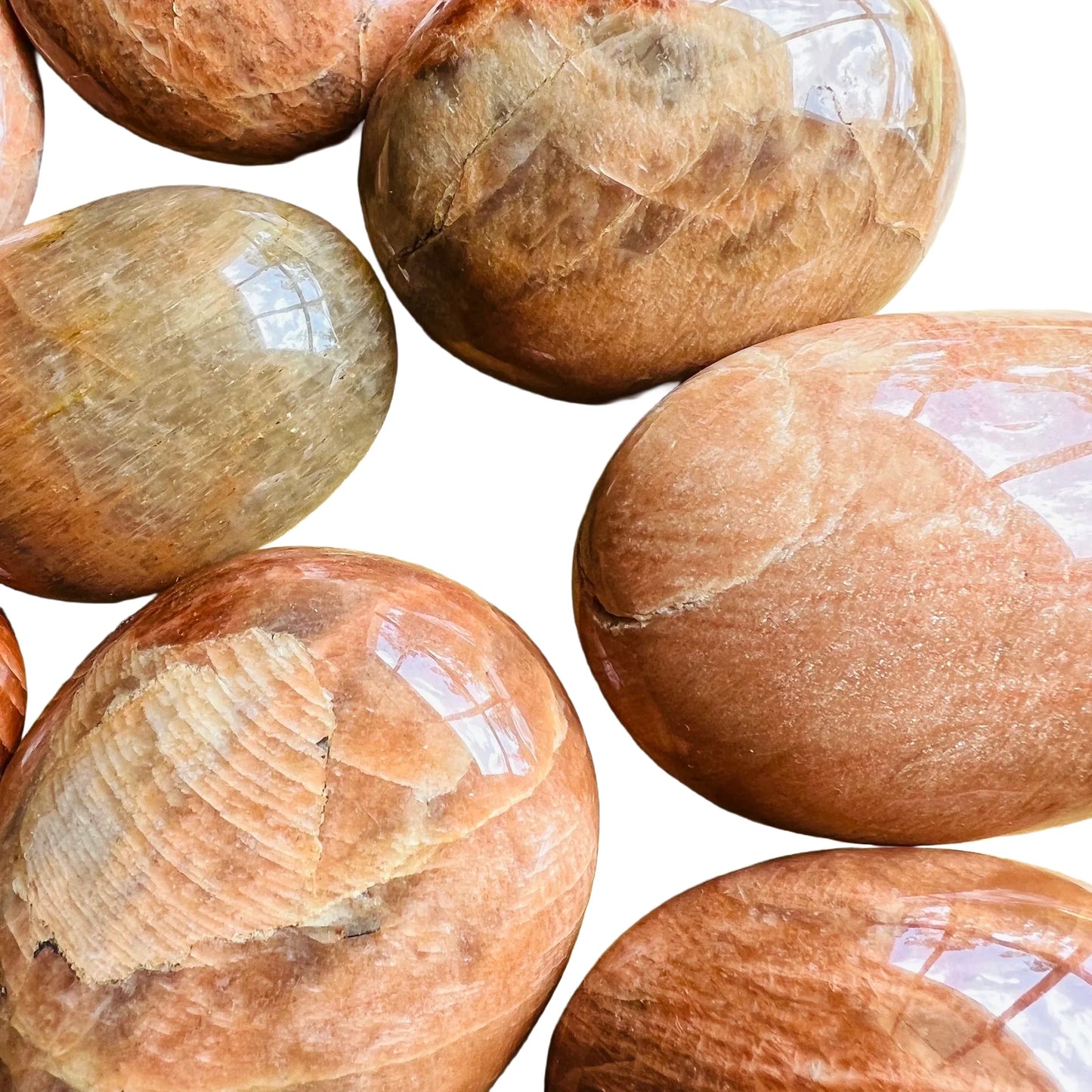 Bird's-eye view of Grade AA Peach Moonstone palm stone, traditionally used for Emotional Healing.
