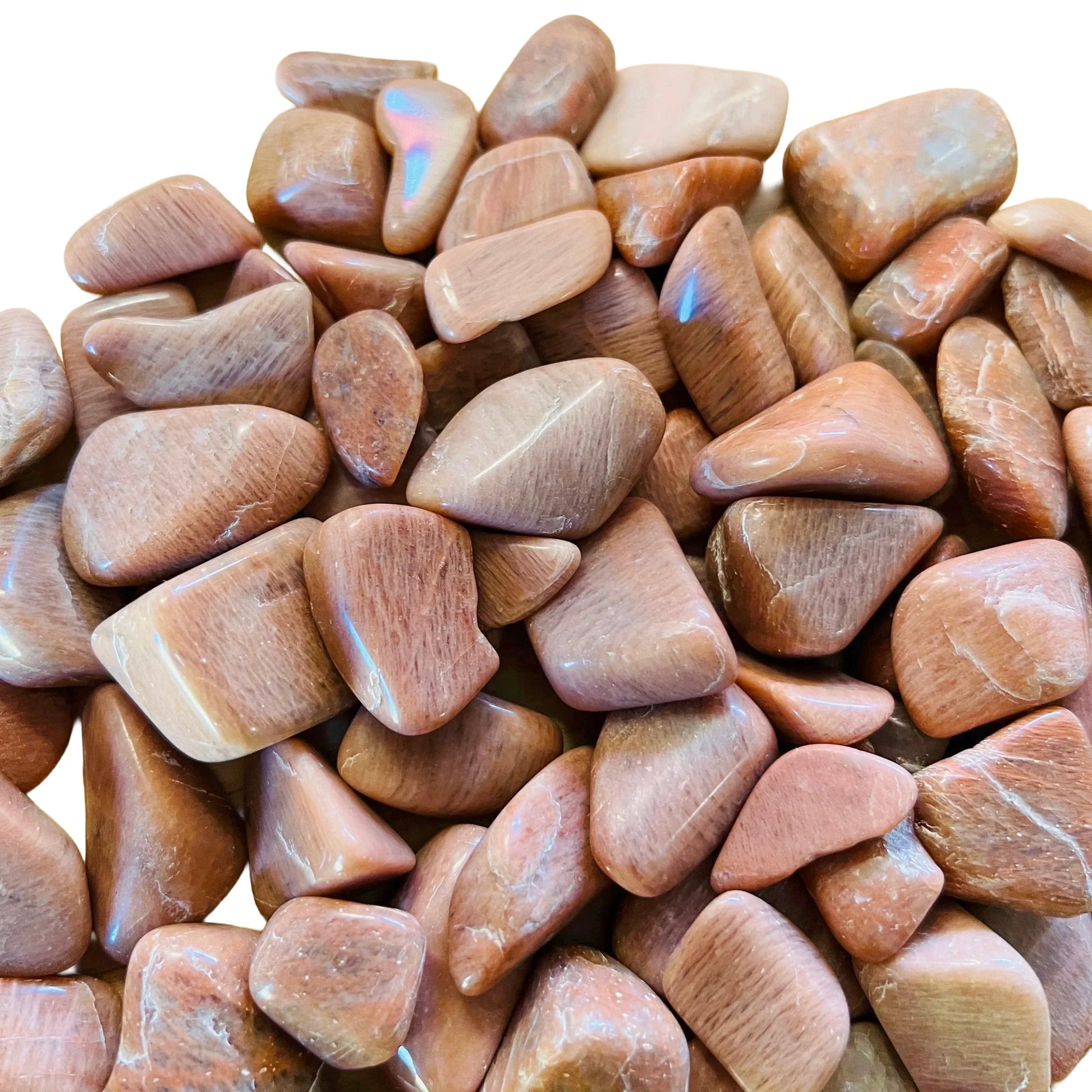 Magnified detail of Peach Moonstone tumbled stone, Madagascar-sourced, turned to for Emotional Healing and Self Love.