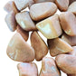 Plan view of Peach Moonstone tumbled stone, from Madagascar, showing natural inclusions.