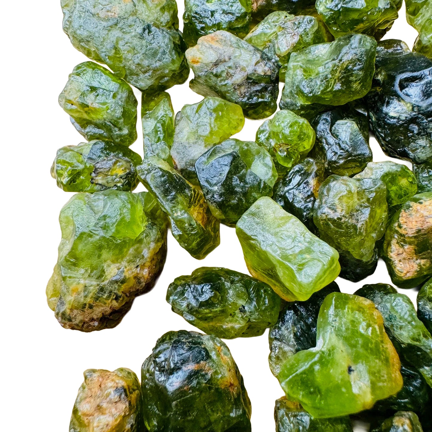 Top-down shot of Peridot raw stone, showing natural inclusions, hand-selected from San Carlos Apache Reservation, Arizona, United.