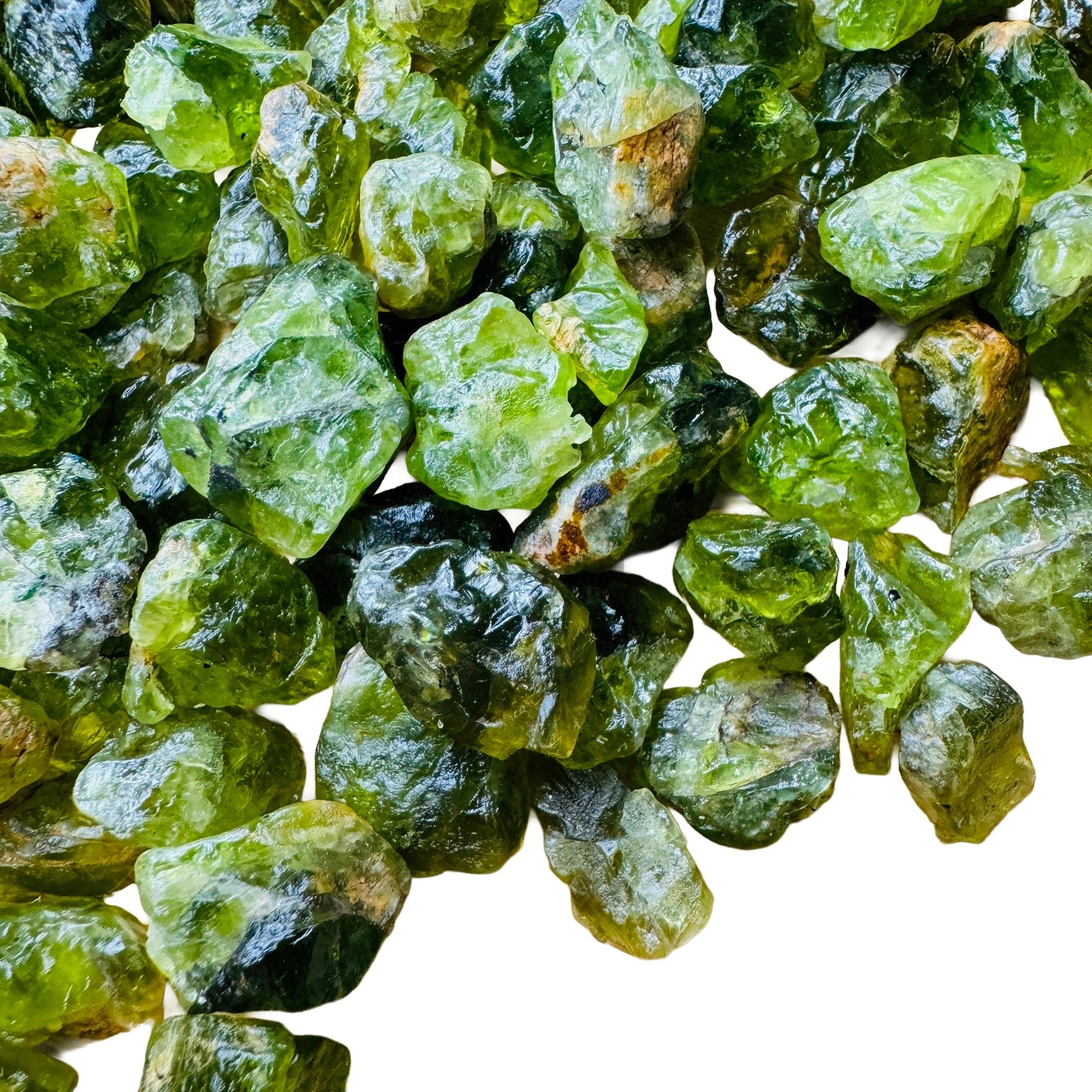 Back view of Peridot raw stone, kept close for Abundance, United States-sourced.