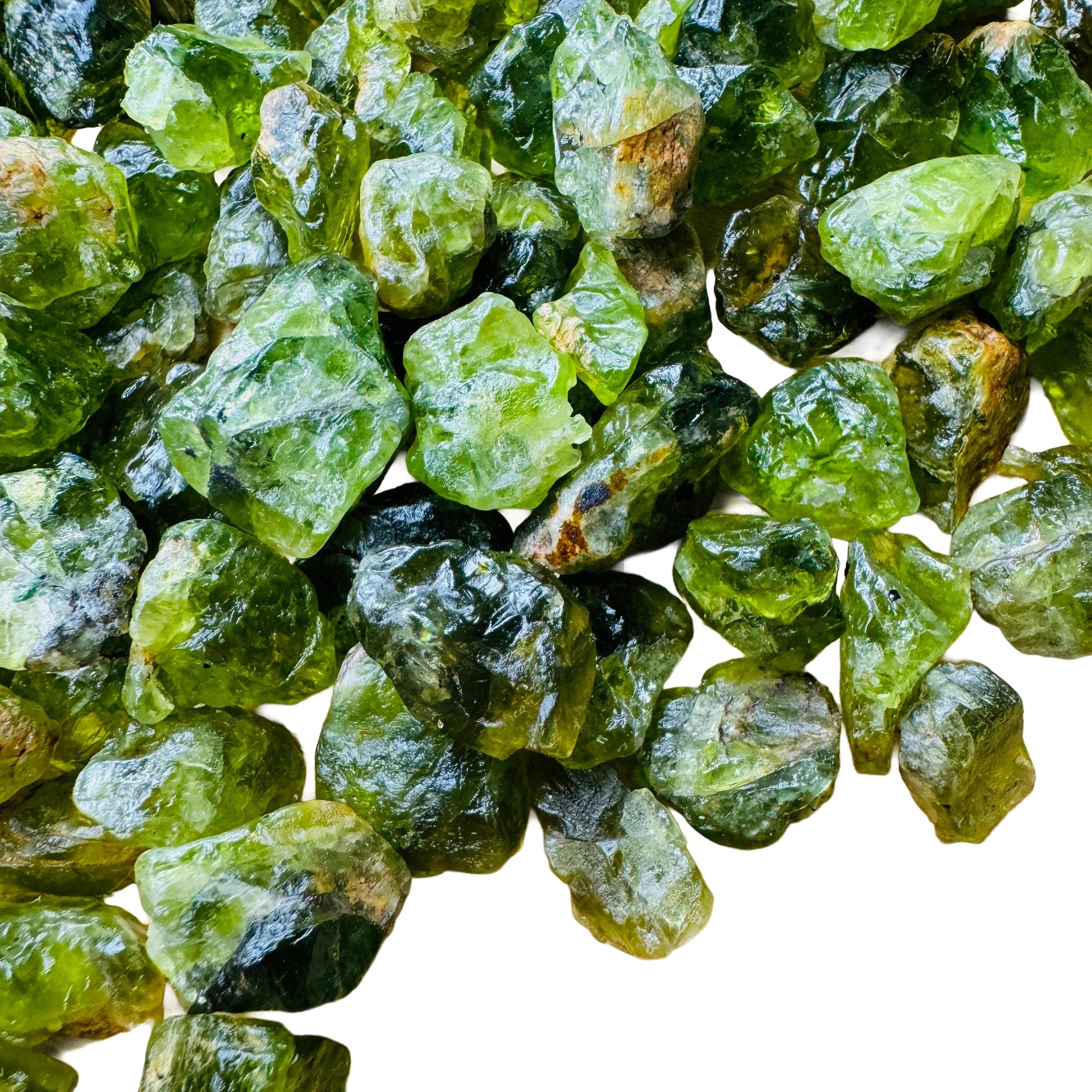 Back view of Peridot raw stone, kept close for Abundance, United States-sourced.