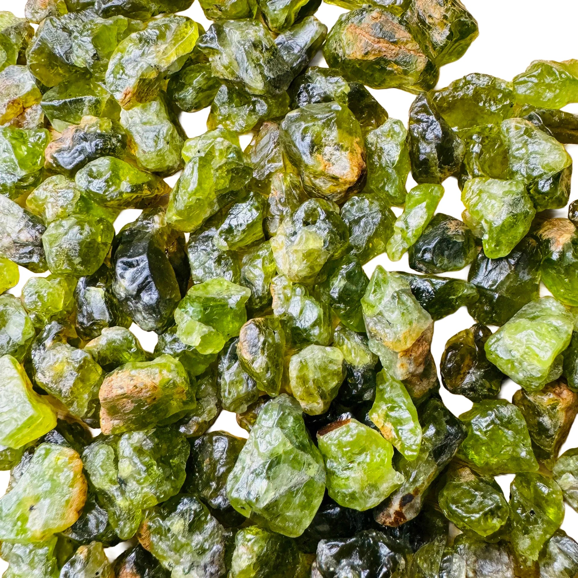 Daylight view of a Peridot raw stone carried for Abundance.
