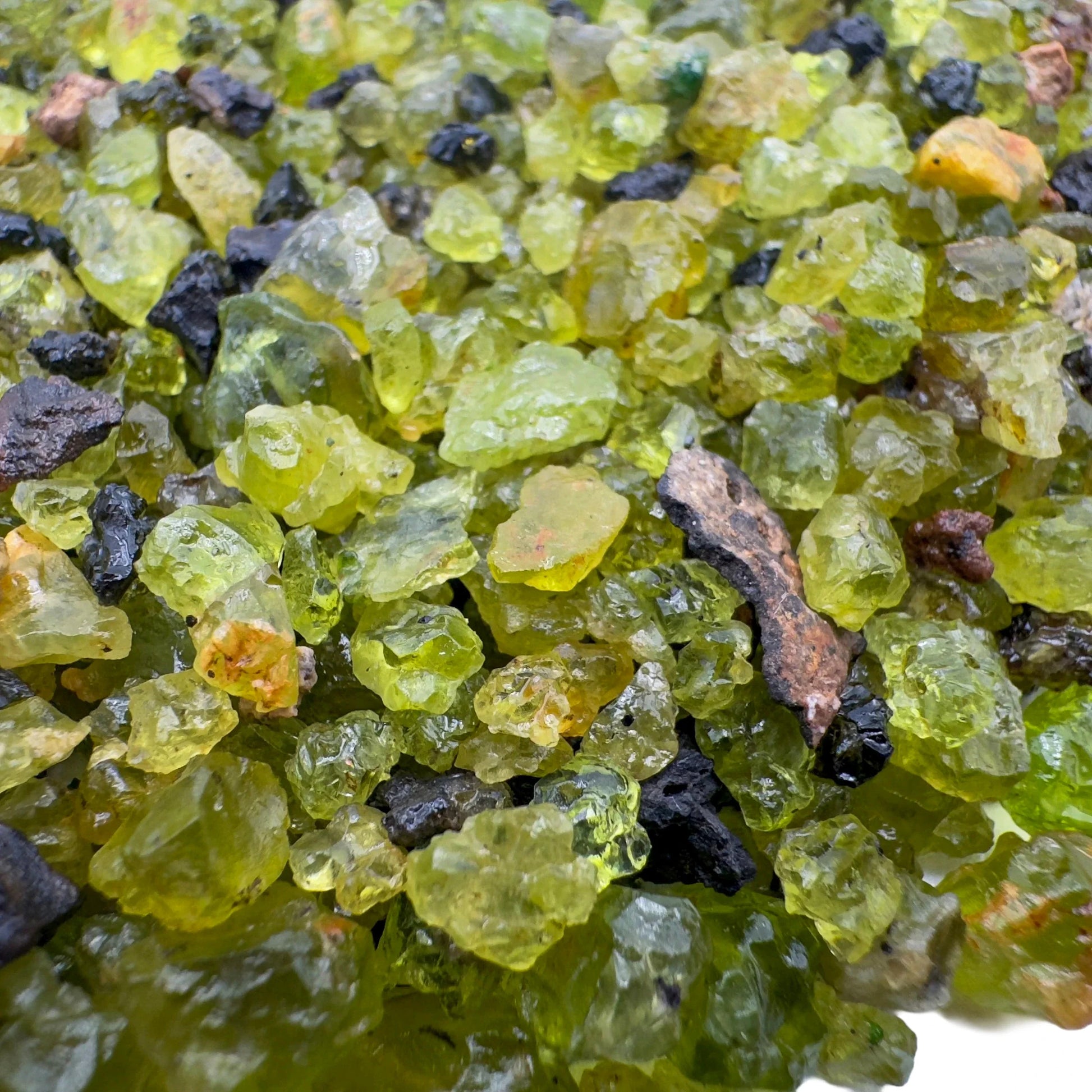 Back view of Peridot raw stone, from United States, worked with for Abundance.