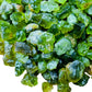Lateral view of Peridot raw stone, showing natural color depth.