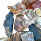 Overhead angle of Petrified Wood raw stone, Madagascar-sourced, carried for Grounding.