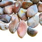 Side profile of Pink Agate tumbled stone, showing natural texture.