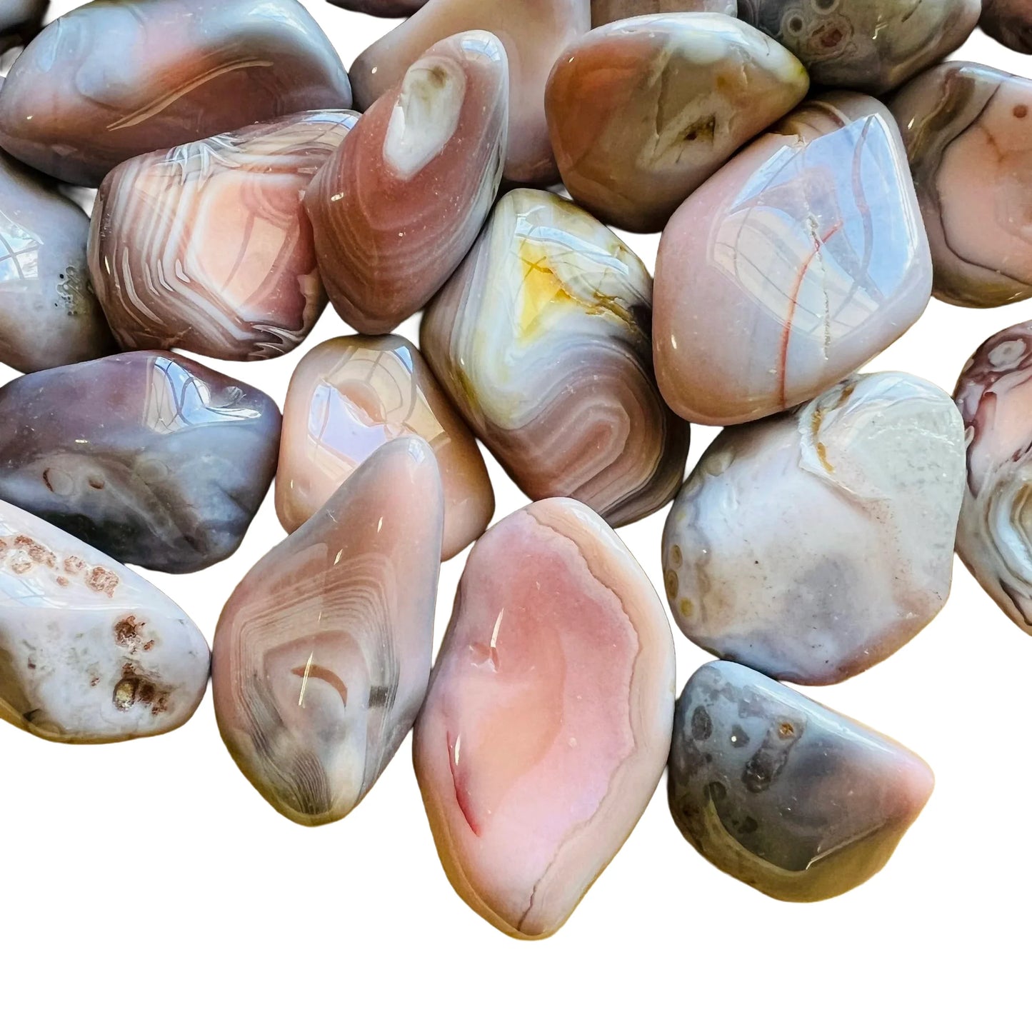 Side profile of Pink Agate tumbled stone, showing natural texture.