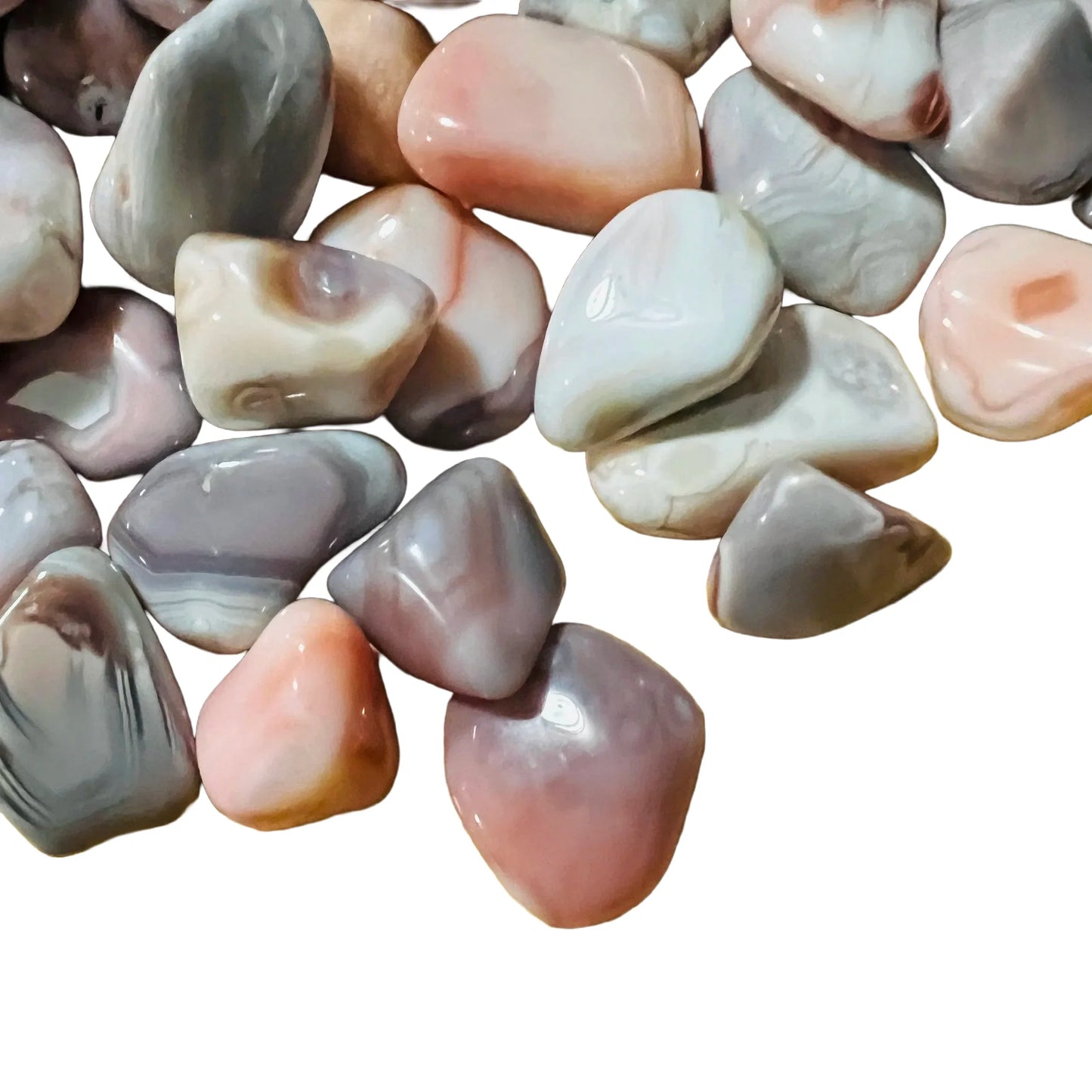 Surface detail of Pink Agate tumbled stone, kept near for Love, showing characteristic patterning.