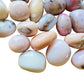 Detail capture of Pink Opal tumbled stone, showing characteristic patterning.