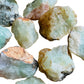 Alternate angle of green Prehnite raw stone, showing characteristic finish, from Kunene, Namibia.