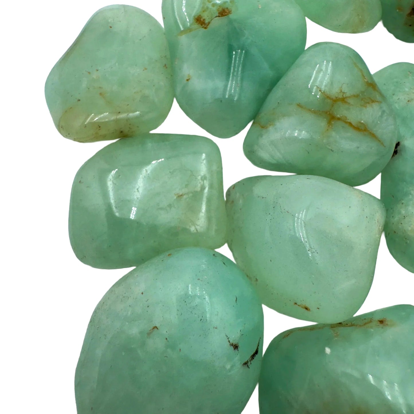 Underside view of Grade AA green Prehnite tumbled stone, showing color depth.