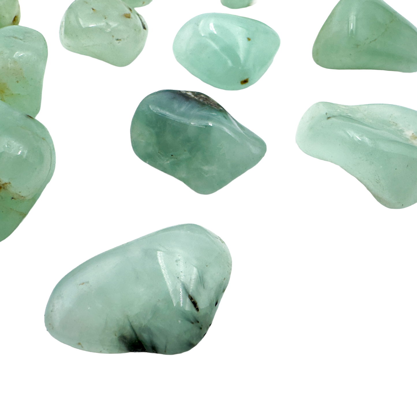Soft green Prehnite tumbled crystals showing natural inclusions, ethically sourced from Namibia by Beyond Bohemian