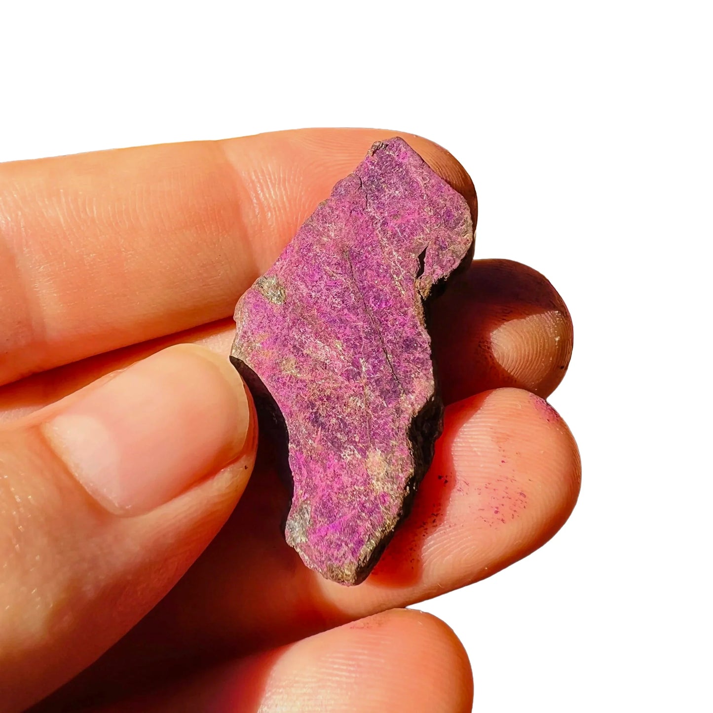 Detail shot of Grade A Purpurite raw under natural light