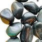 Profile view of Rainbow Obsidian tumbled stone, from Mexico, often paired with practices around Emotional Healing.