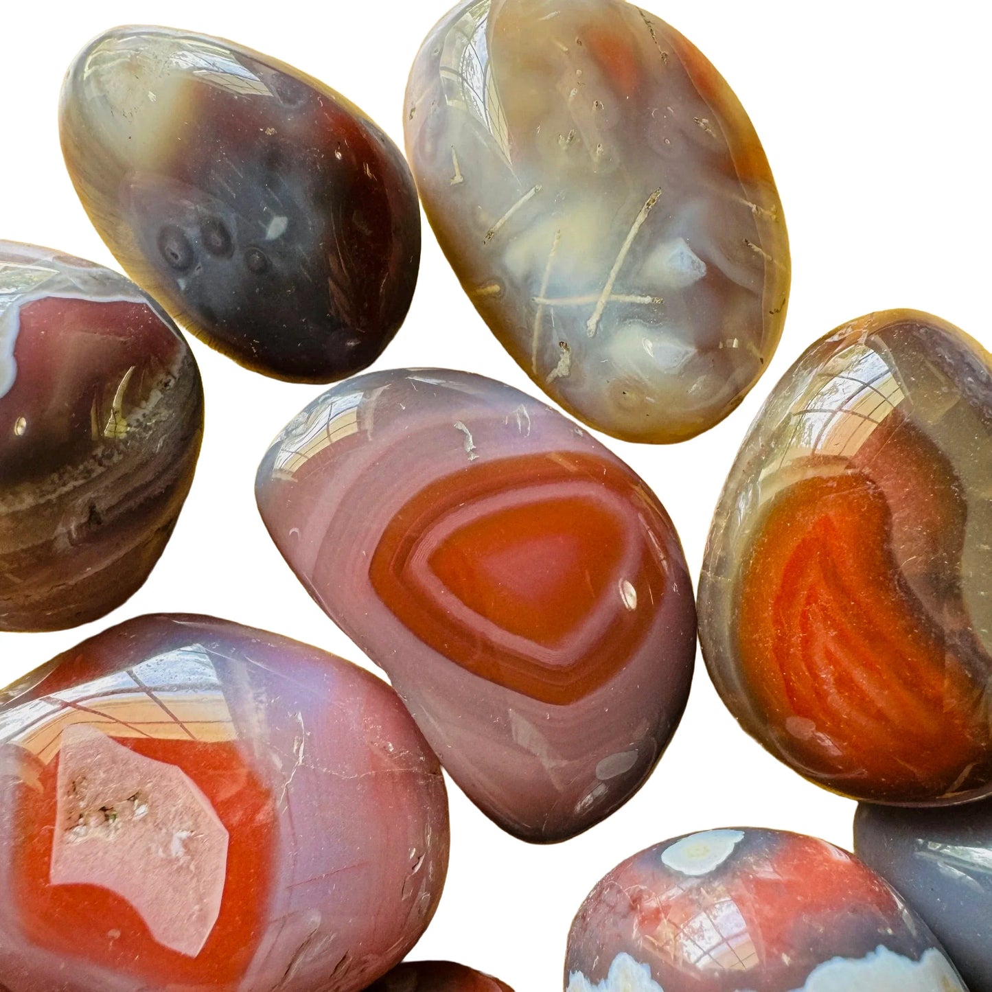 Near view of Red Agate tumbled stone, sourced from Zimbabwe.