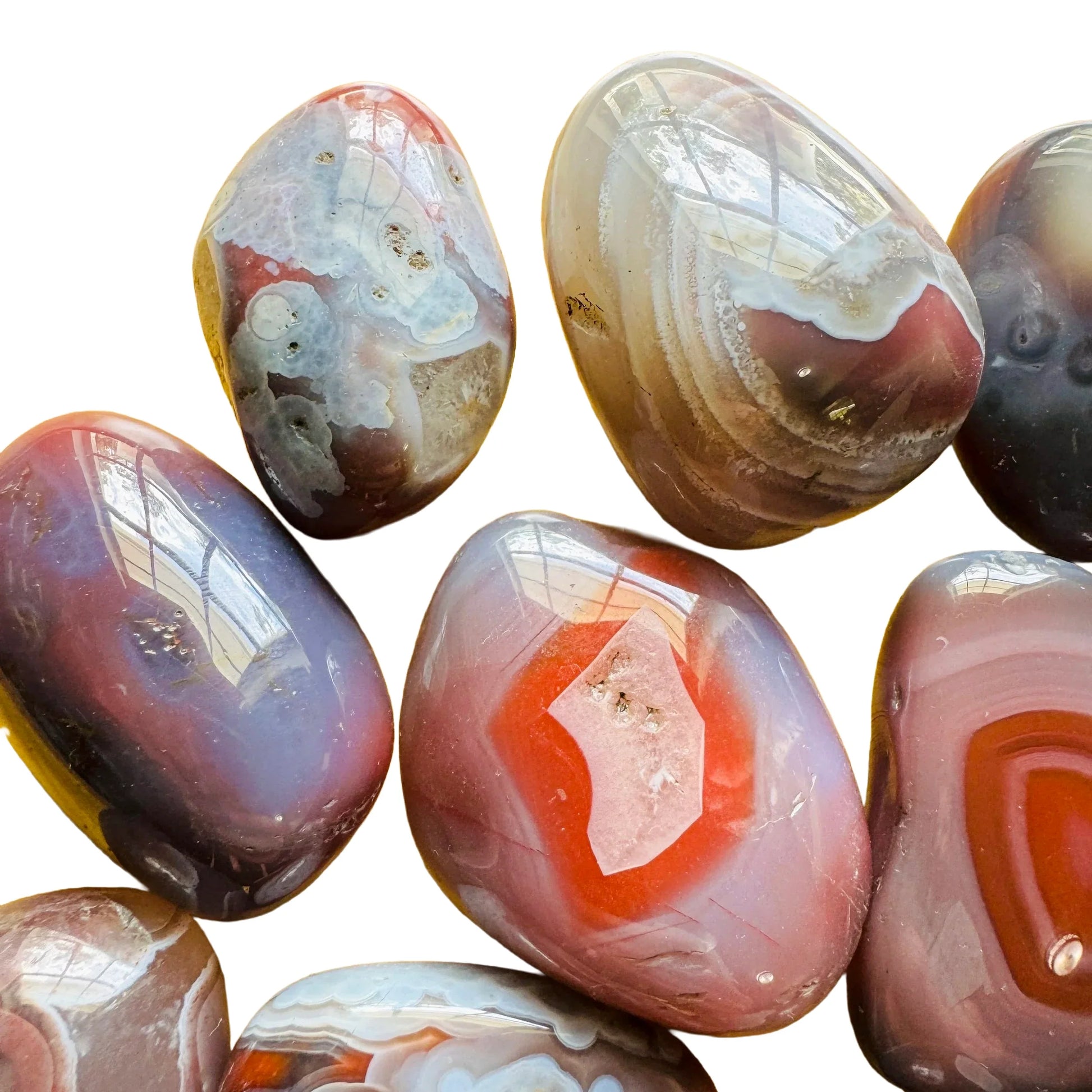 Profile view of Red Agate tumbled stone, sourced from Zimbabwe, linked to Grounding.