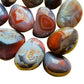 Bird's-eye view of Red Agate tumbled stone, showing characteristic color.