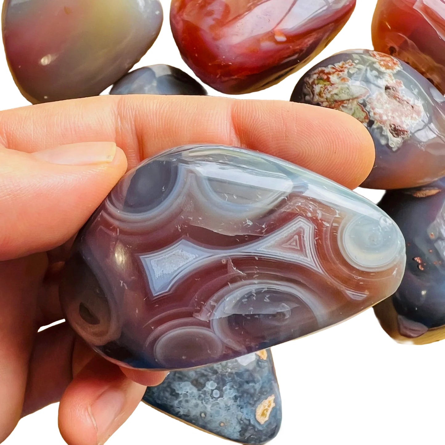 Back view of Grade AA Red Agate palm stone showing natural surface