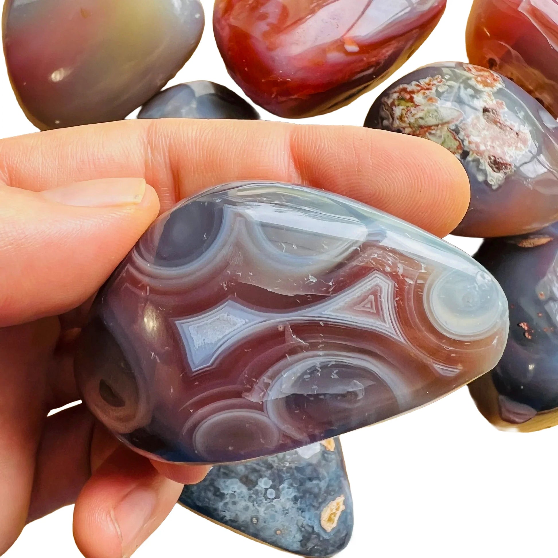 Back view of Grade AA Red Agate palm stone showing natural surface