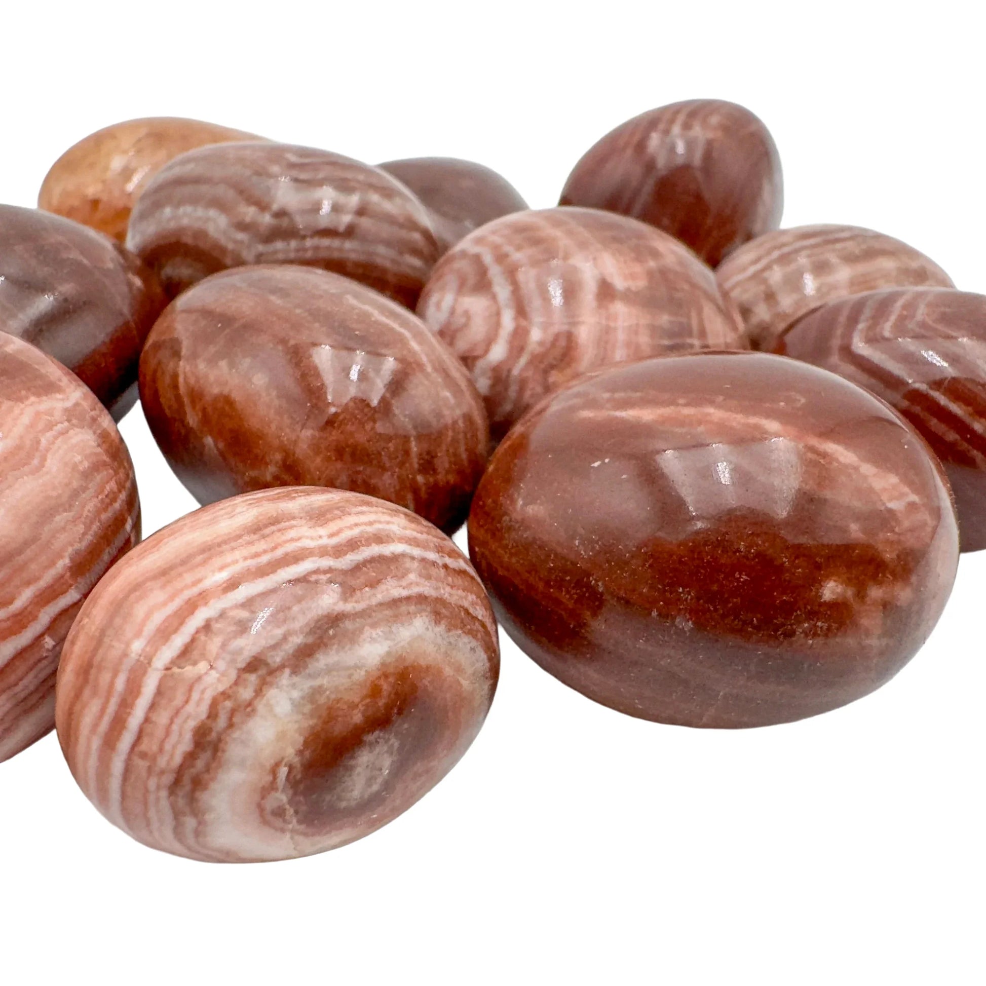 Up-close view of Red Aragonite tumbled stone, often kept for Energy and Confidence.