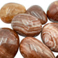 Underside detail of Red Aragonite tumbled stone, for Energy.