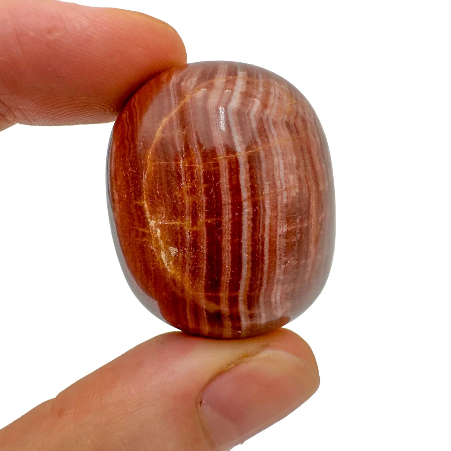 Back view of Grade AAA Red Aragonite tumbled stone showing natural surface