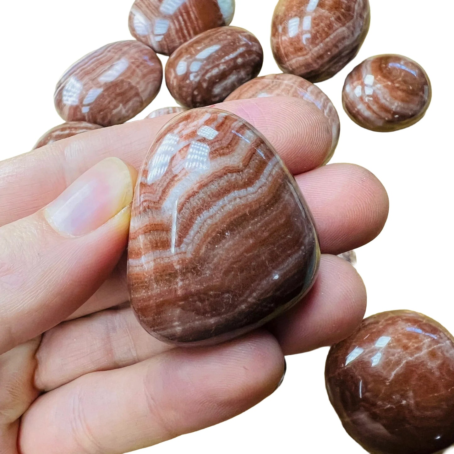 Full profile of Grade AAA Red Aragonite tumbled stone ready to ship from Beyond Bohemian