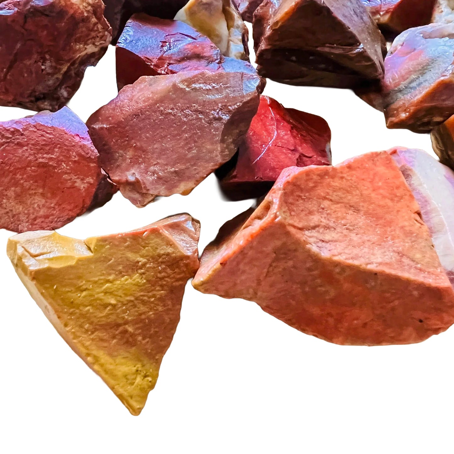 Detail of Grade AA Red Jasper raw stone, Madagascar-sourced, showing characteristic patterning.