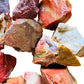 Overhead view of Red Jasper raw stone, Madagascar-sourced, to support Grounding.