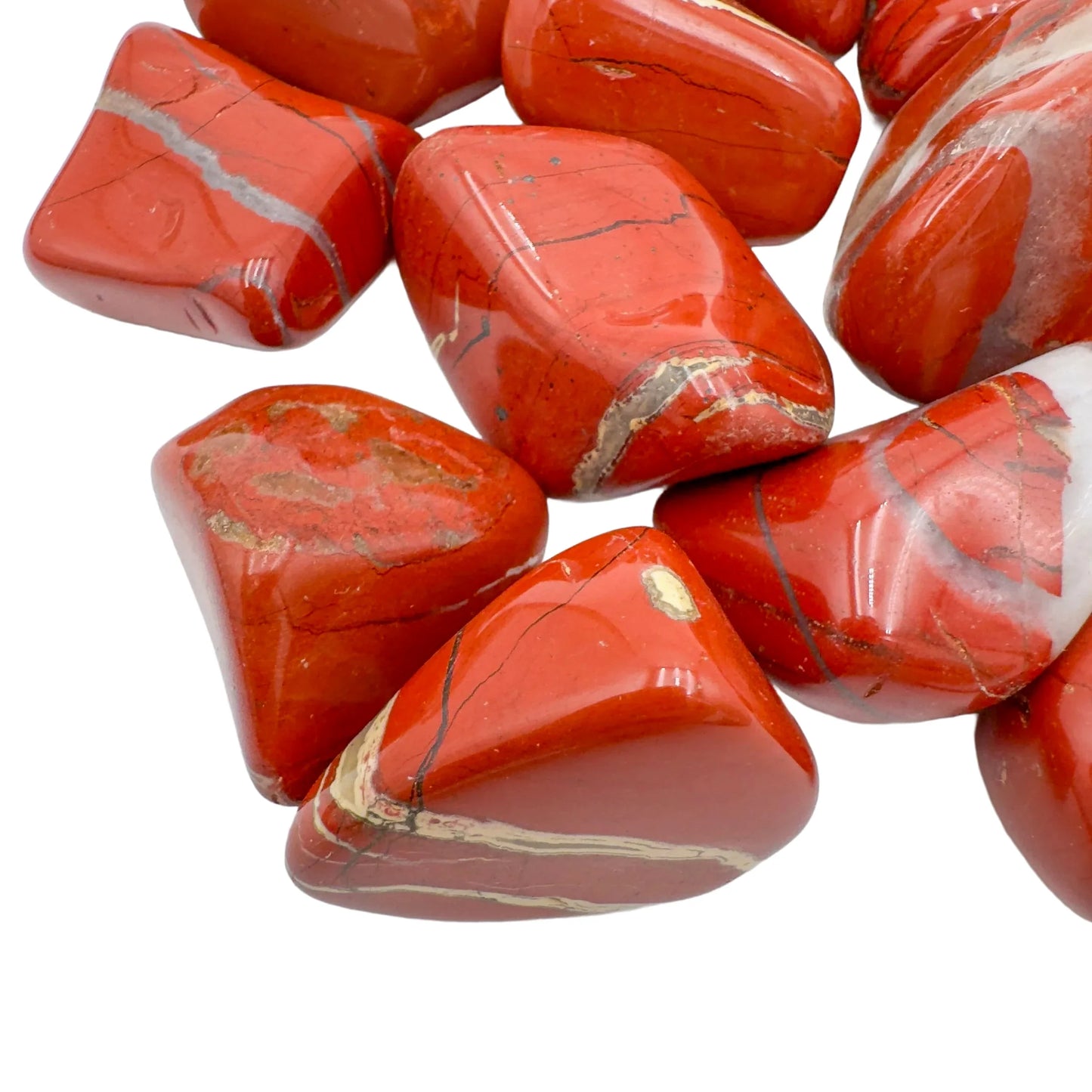 Top-side view of Grade AA Red Jasper tumbled stone, showing characteristic patterning, kept near for Grounding.