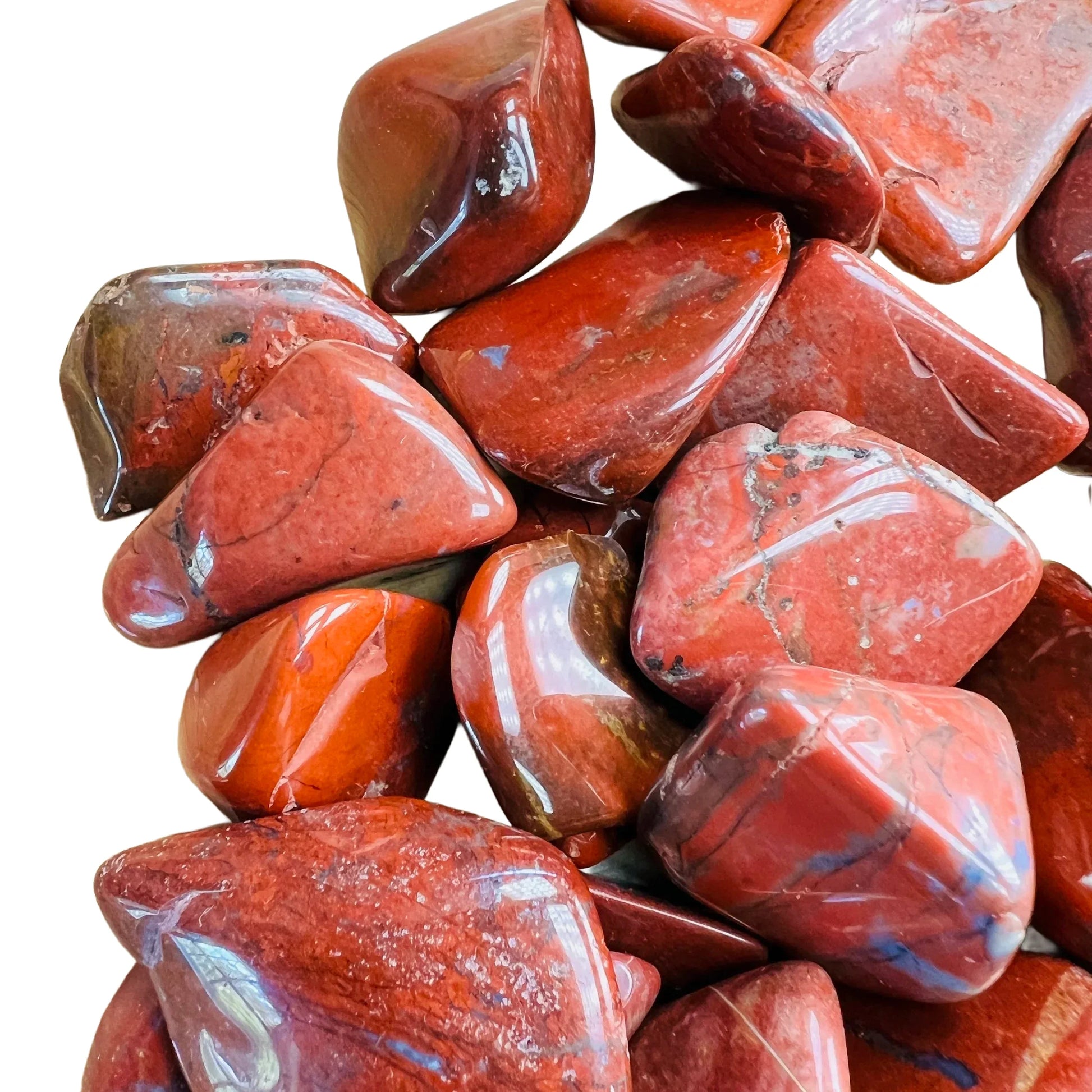 Side perspective of Red Jasper tumbled stone, carried for Grounding, showing characteristic finish.