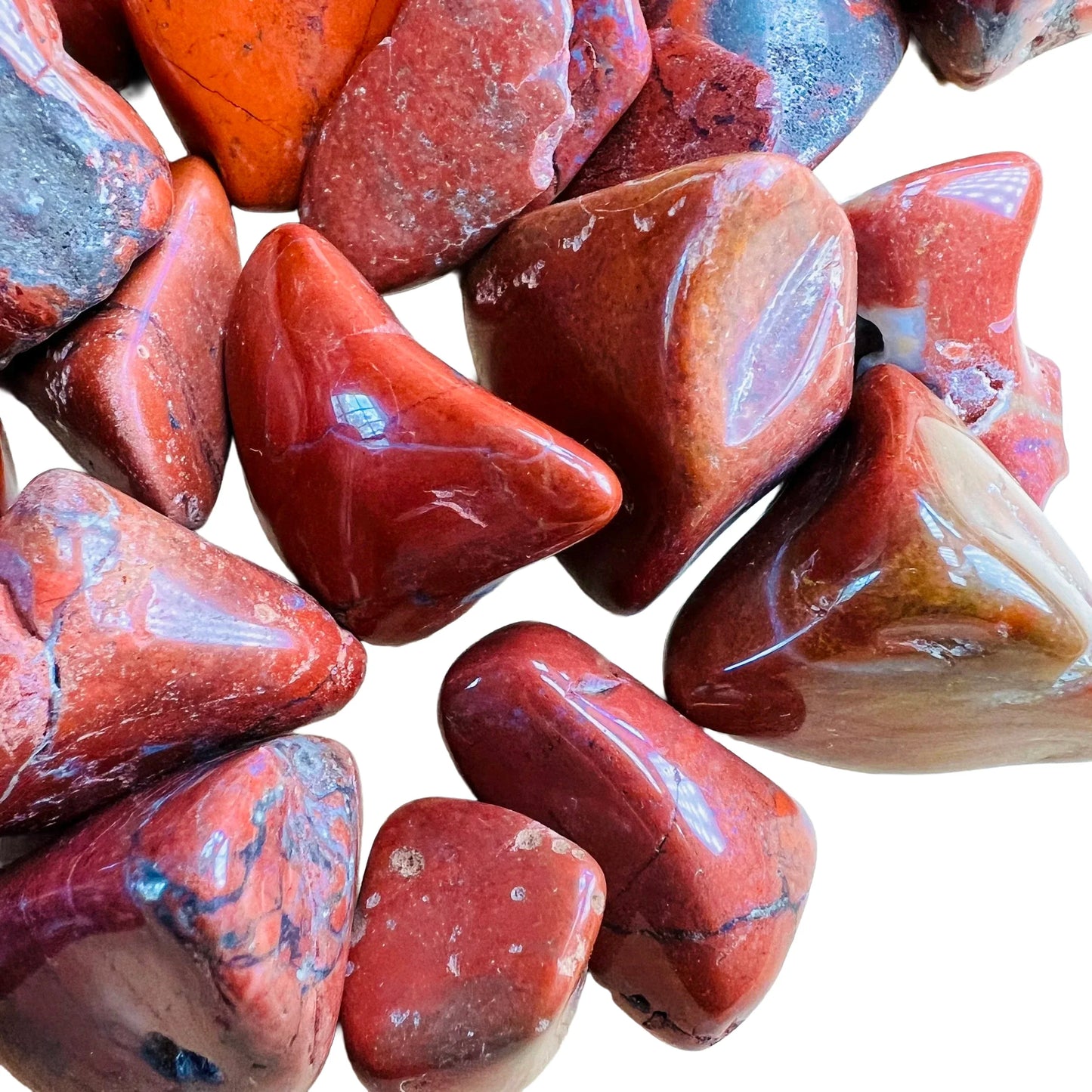 Top view of Red Jasper tumbled stone, carried for Grounding, showing earthy tone.