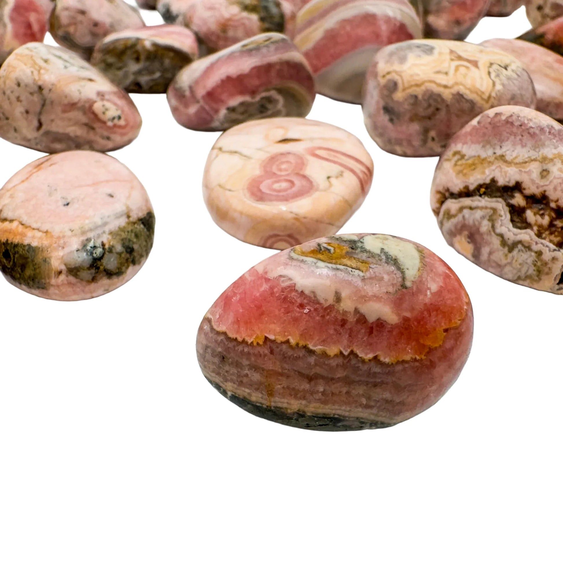 Side angle of Rhodochrosite tumbled stone, sourced from Argentina.