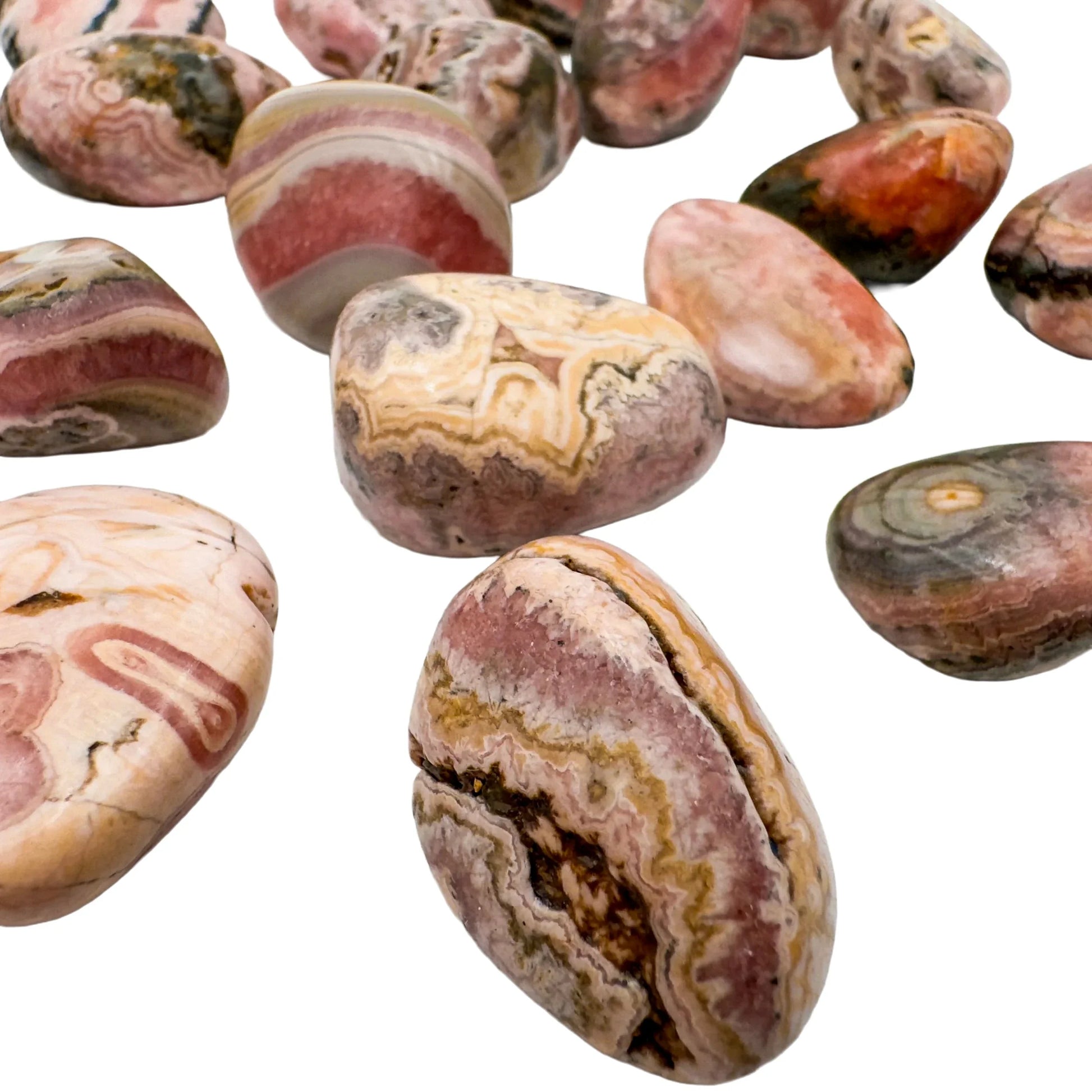 Top-down shot of Rhodochrosite tumbled stone, for Emotional Healing, sourced from Argentina.