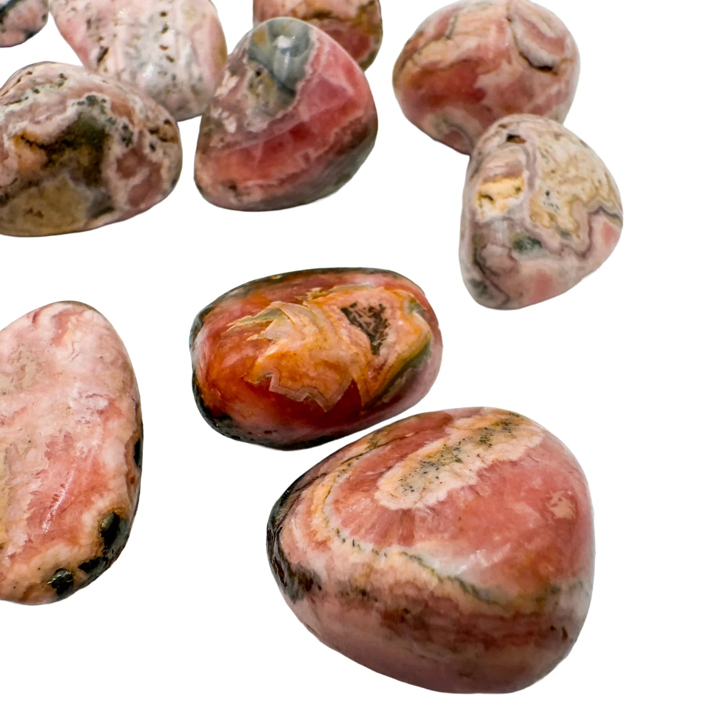 Underside view of Grade A Rhodochrosite tumbled stone, often paired with practices around Emotional Healing and Love.