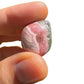 Full profile of Grade A Rhodochrosite tumbled stone ready to ship from Beyond Bohemian