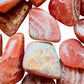Size comparison with a Rhodochrosite tumbled stone, Argentina-sourced.