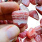 Full profile of Grade AA Rhodochrosite tumbled stone ready to ship from Beyond Bohemian