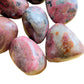 Profile view of Rhodonite freeform, often worked with for Emotional Healing, showing characteristic finish.