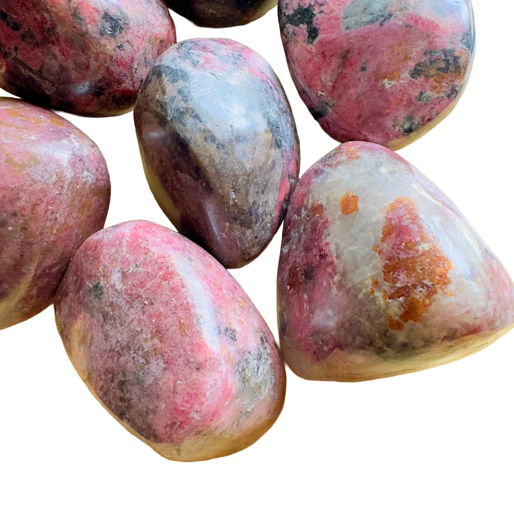 Profile view of Rhodonite freeform, often worked with for Emotional Healing, showing characteristic finish.