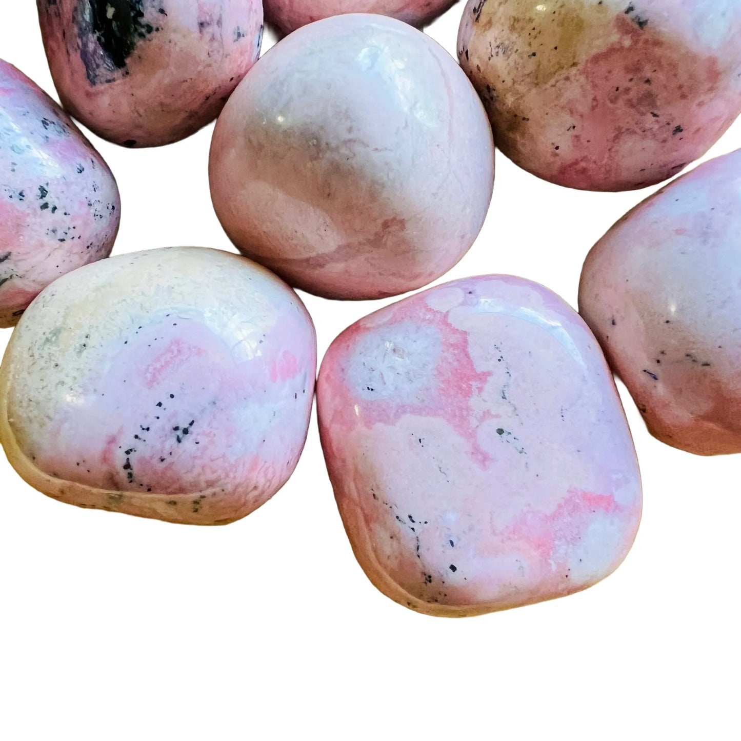 Detail capture of Rhodonite tumbled stone, showing characteristic color, from Ancash, Peru.