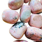 Top angle of Grade AA pink Rhodonite tumbled stone, worked with for Emotional Healing and Love, sourced from Ancash, Peru.