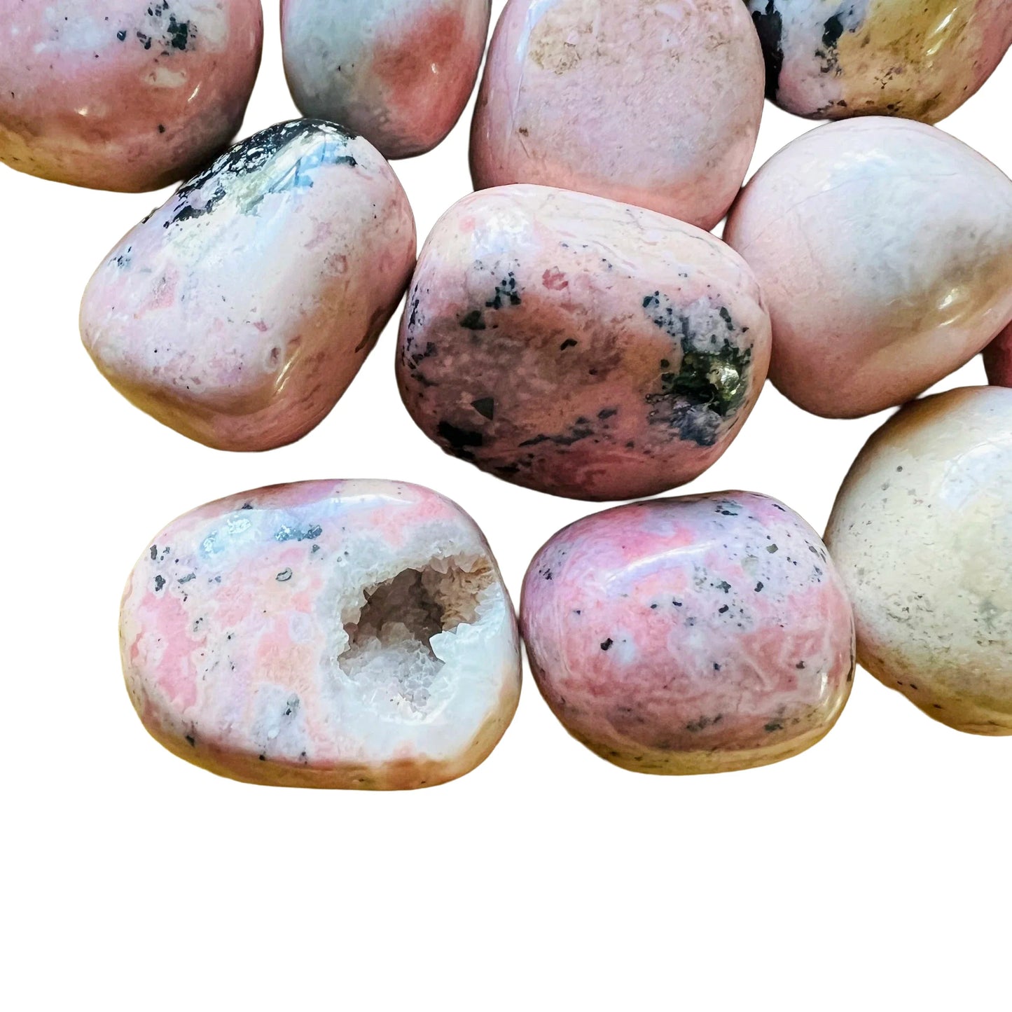 Rear view of Grade AA Rhodonite tumbled stone, showing characteristic color, sourced from Ancash, Peru.