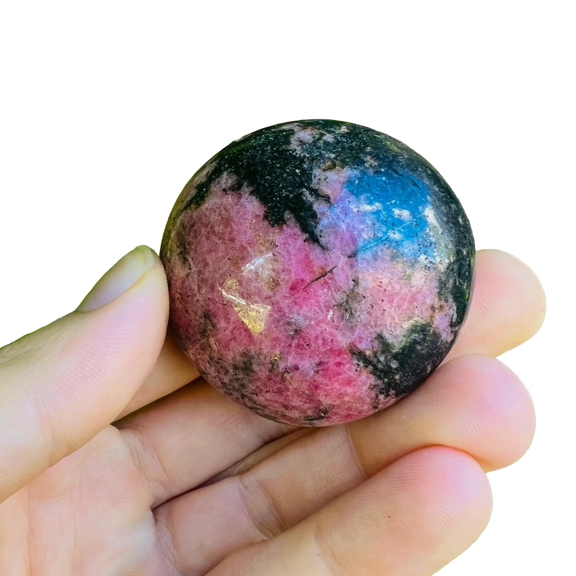 Macro view of Rhodonite palm stone, showing translucent edges, sourced from Atsimo-Andrefana, Madagascar.