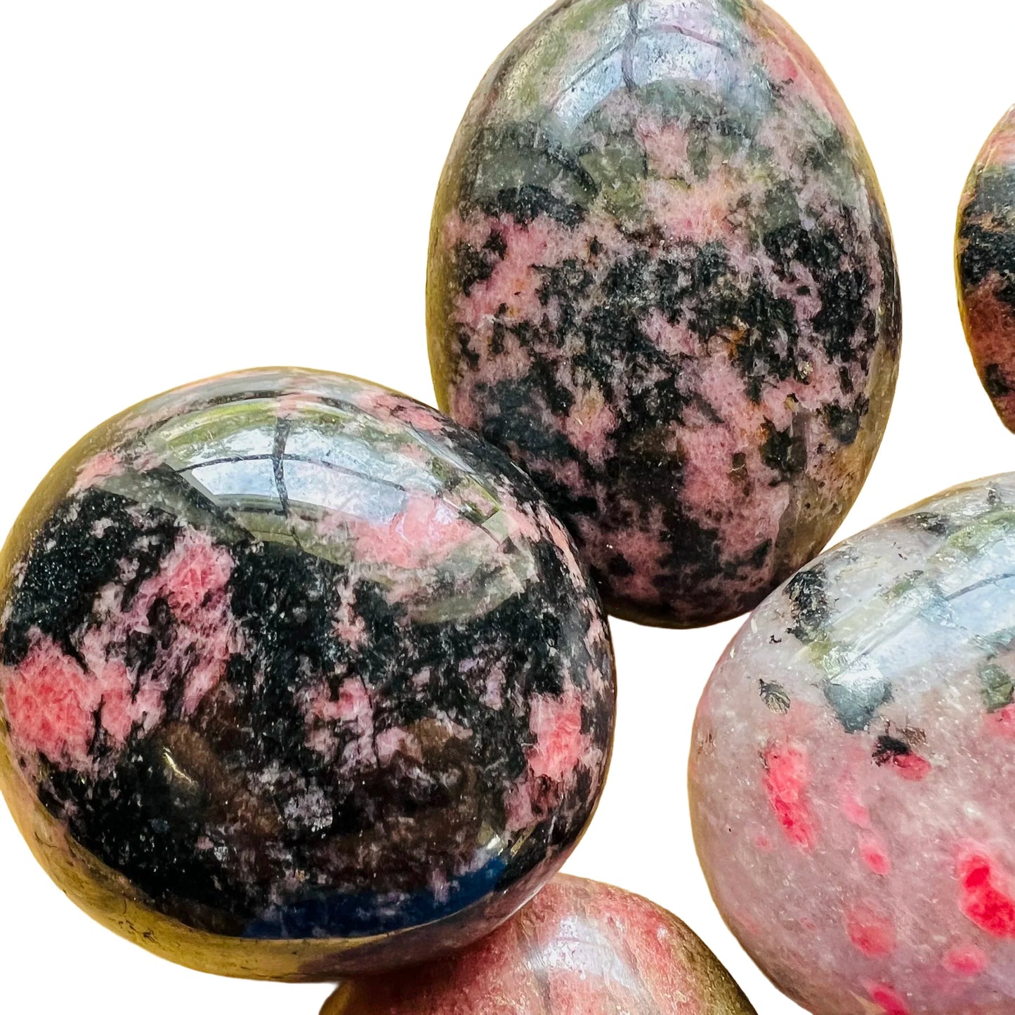 Full profile of Grade AA Rhodonite palm stone ready to ship from Beyond Bohemian
