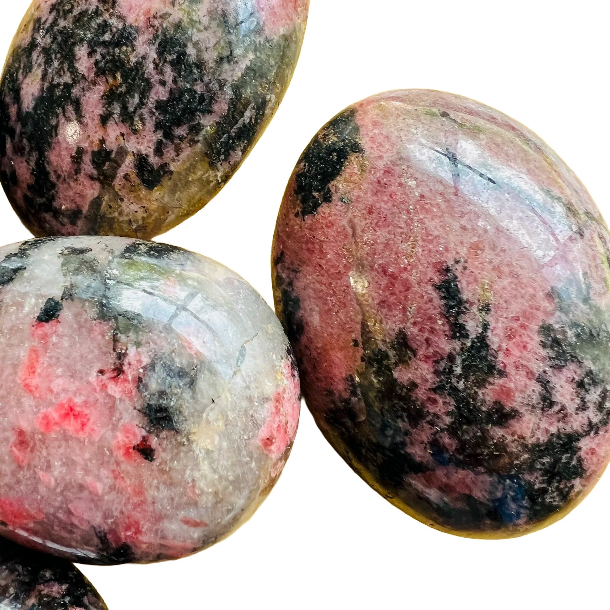 Full profile of Grade AA Rhodonite palm stone ready to ship from Beyond Bohemian