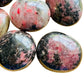 Full profile of Grade AA Rhodonite palm stone ready to ship from Beyond Bohemian